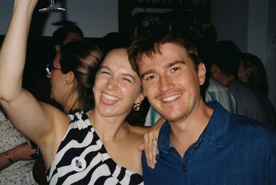 Jojo and Louis laughing together at a party