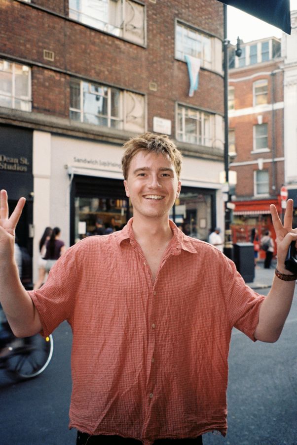 Louis cheering on a London street