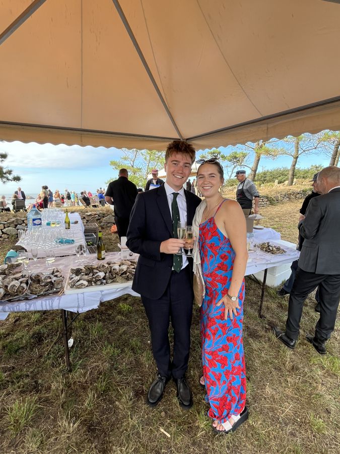 Jojo and Louis dressed up at a wedding