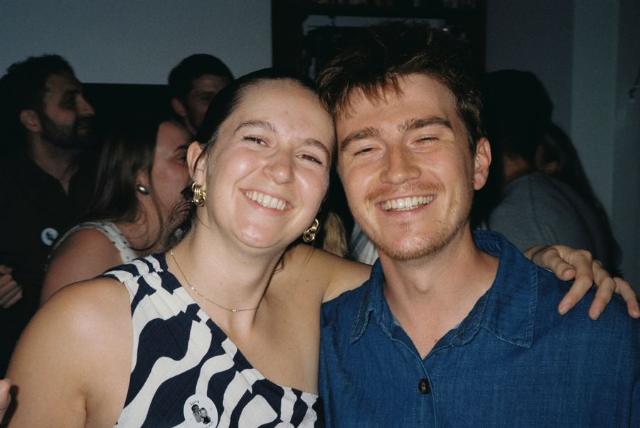 Jojo and Louis smiling together at a party